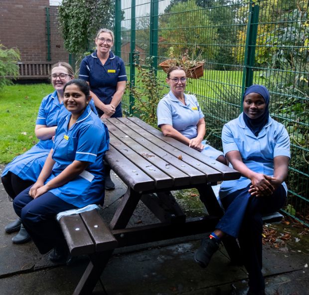 staff members at picnic bench