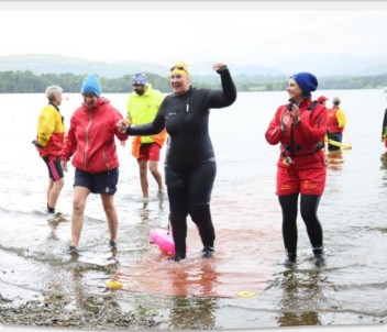 swimmer leaving lake