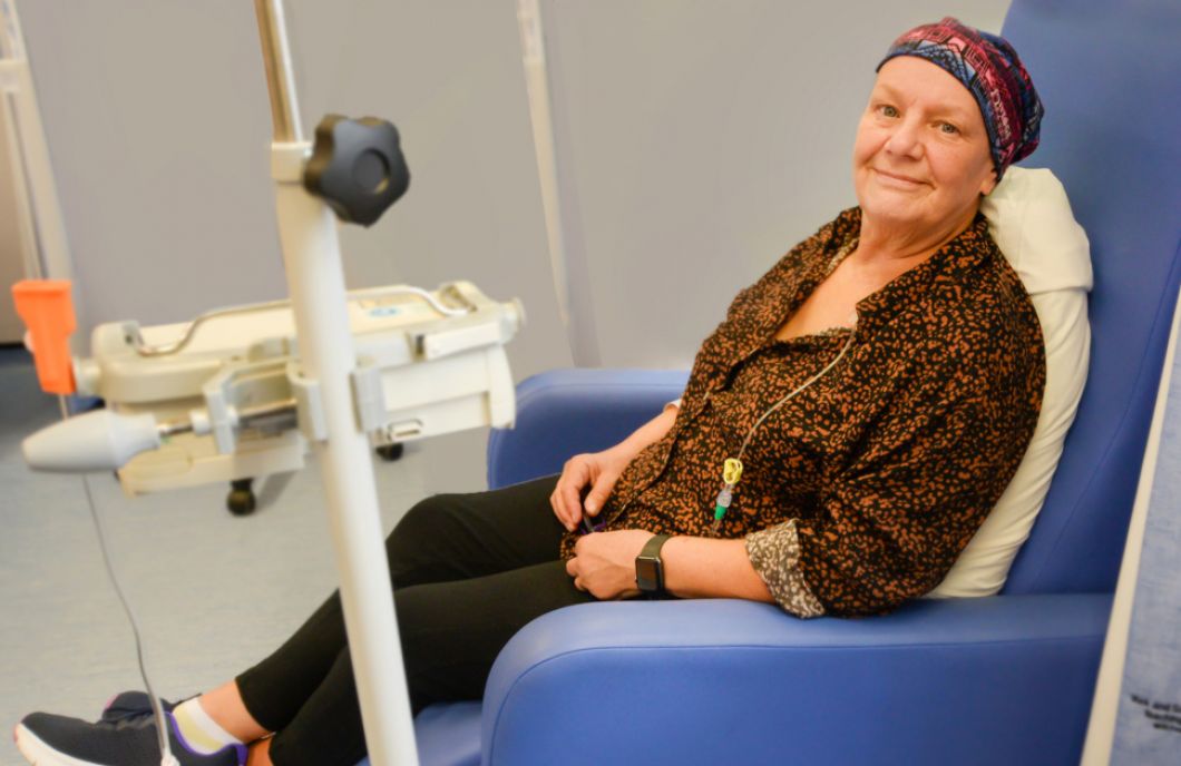 patient smiles in comfortable chair 