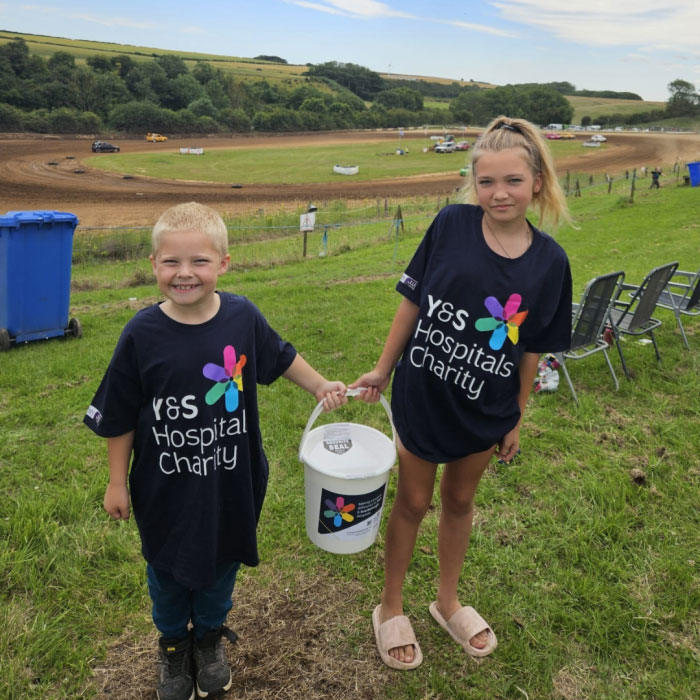 Boy and girl holding bucket