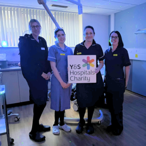 midwives with charity sign in labour room