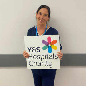 Leanne holding York & Scarborough Hospitals Charity Sign