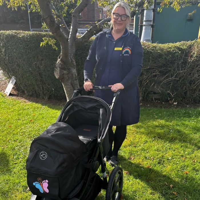 Bereavement burse stood with pram in Hospital grounds